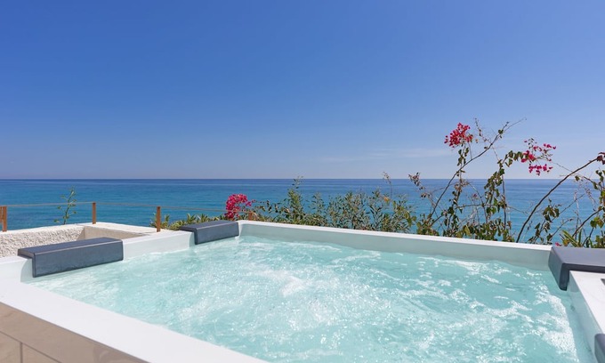 Villajoyosa Villa | Charming Costa Blanca Villa | Villa Robero | 3 Bedrooms | Beachfront | Spectacular Sea Views | Spacious Furnished Sun Terrace with Private Hot Tub | BBQ facilities | Outdoor Dining Area | Villajoyosa
