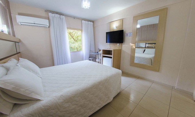 Foz do Iguacu City Centre Hotel | Lovebirds’ Hideaway-Explore Together: Spacious Double Room Near Attractions